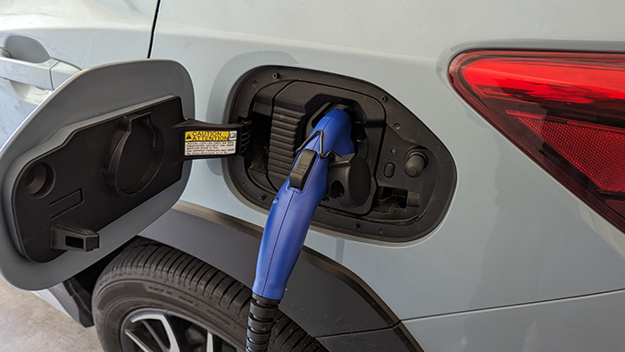 This is one of the standard plugs used by some automakers. It has a converter that can be used with standard household outlets.